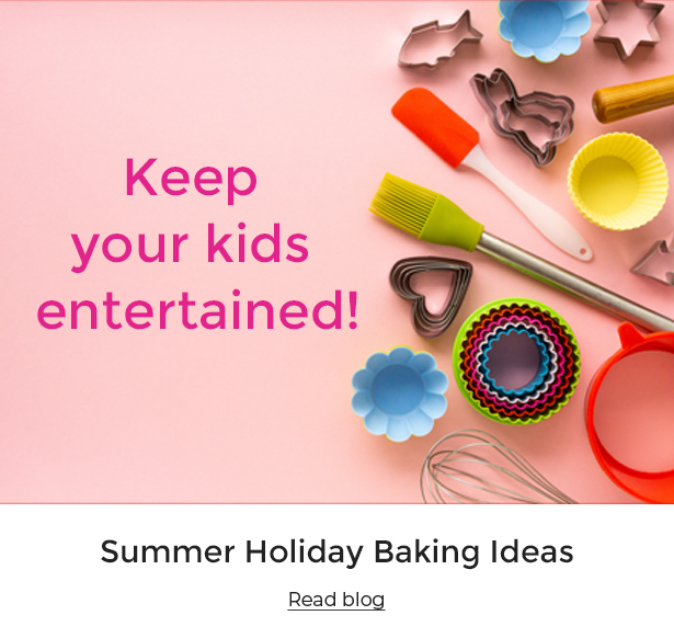 Baking utensils on a pink background