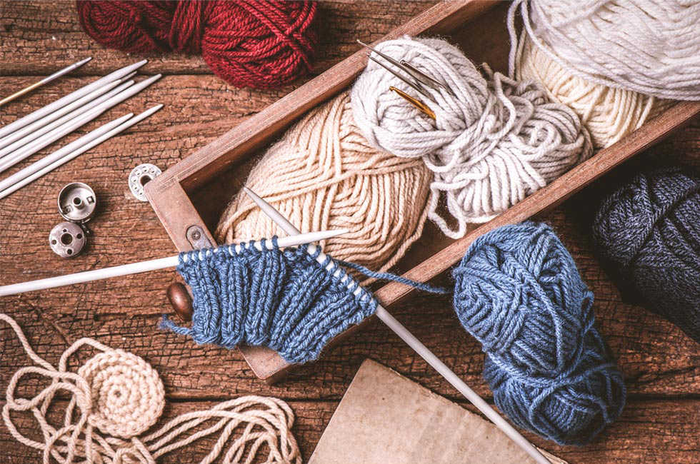 Lots of knitting tools in muted tones.